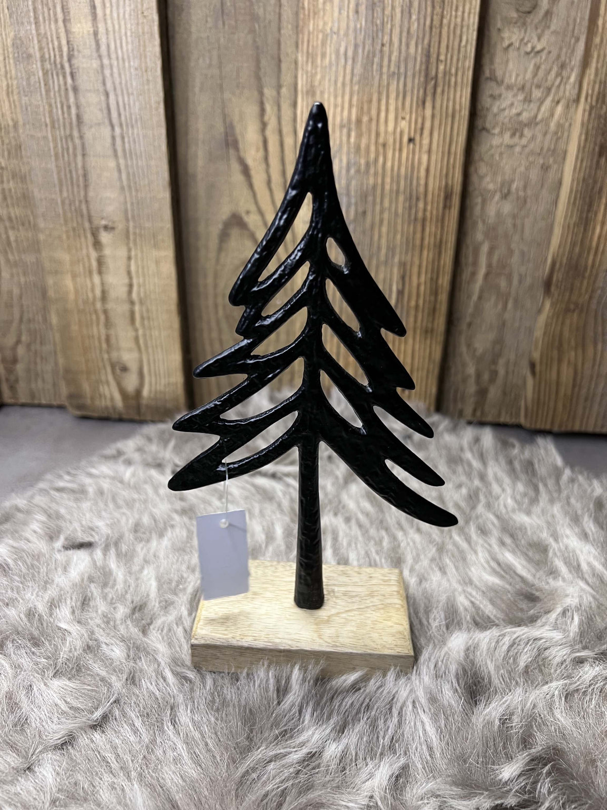 Metallbaum auf Holzsockel